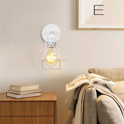 White geometric wire cage wall light with exposed filament bulb decorbites adjustable industrial vintage black iron cage design