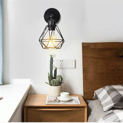 Black geometric cage-style wall light with exposed filament bulb decorbites adjustable industrial vintage design