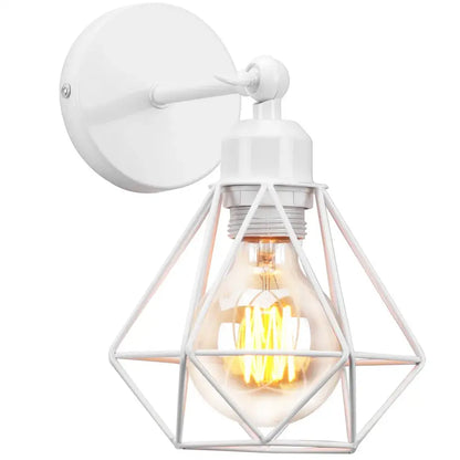 White metal wall light with an adjustable industrial vintage black iron cage design and illuminated Edison bulb for bedroom decorbites