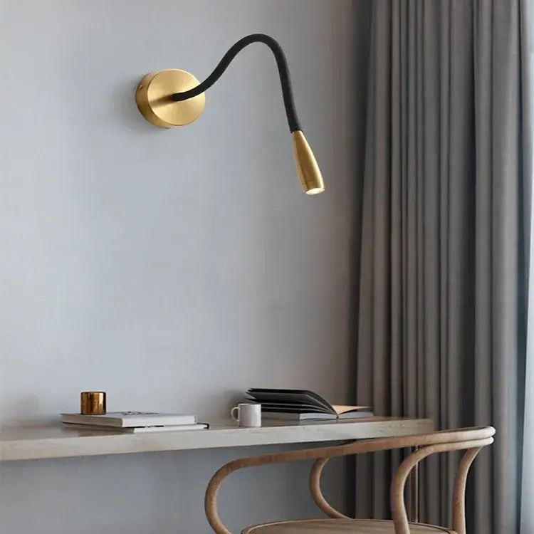 Adjustable nordic bronze wall lamp with gold finish, black flexible gooseneck arm, and adjustable light head by decorbites