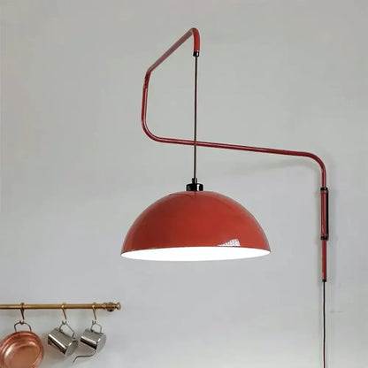 A sleek red metal adjustable nordic pendant wall lamp with a glossy terracotta dome perfect for kitchen islands