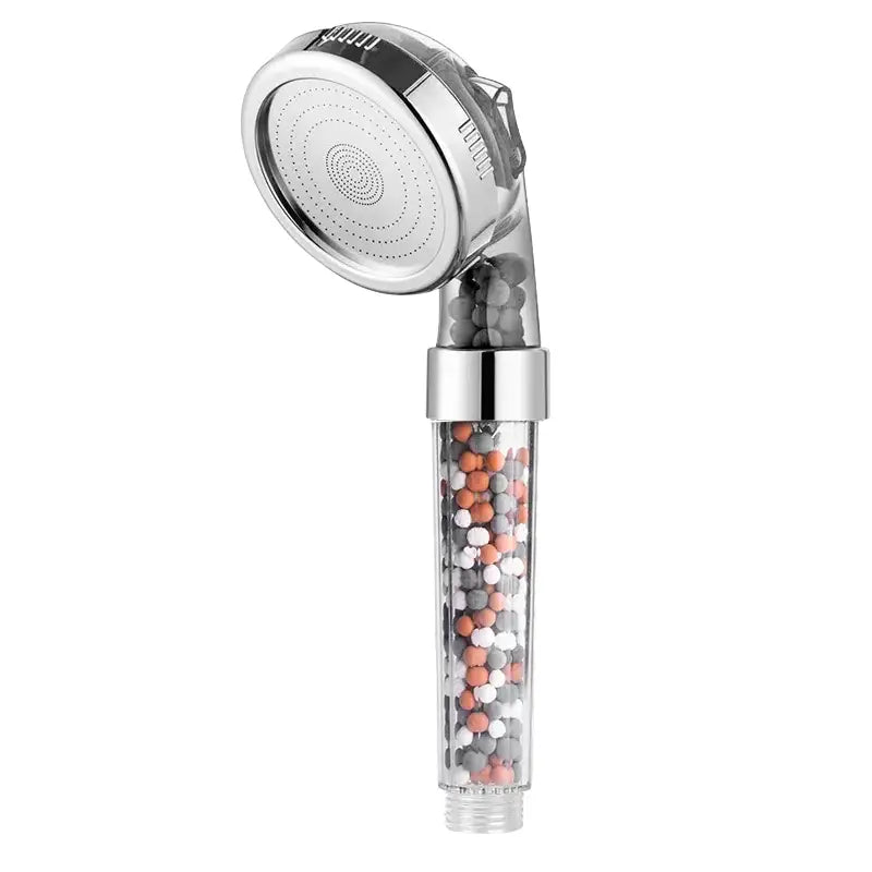 Adjustable shower head with chrome finish and transparent filter housing containing multicolored filtration beads
