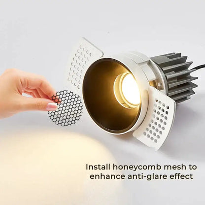 Adjustable white recessed led ceiling downlight with gold interior and heat-dissipating fins for modern living rooms