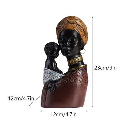 A glossy black and brown resin african exotic black mother and child figurine with gold detailing for decorbites decor