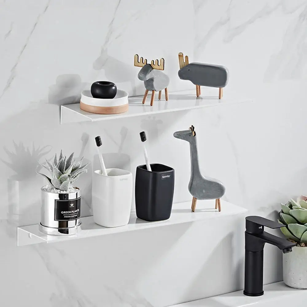 Black rectangular aluminum floating toothbrush holder with matte finish and bomber branding for bathroom decorbites shelves