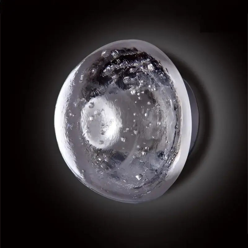 Amber and gold textured crystal led wall lamp with a translucent spherical glass orb featuring bubble decorbites crystal led