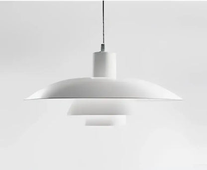 White minimalist pendant light with concentric circular shades in amber and cream geometric glass for dining room