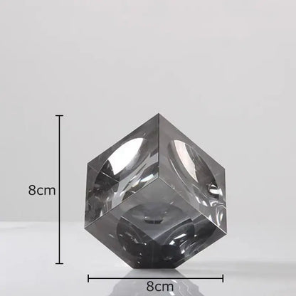 Amber crystal cube statue desk ornament featuring a sleek dark gray translucent crystal cube with polished reflective facets decorbites crystal cube