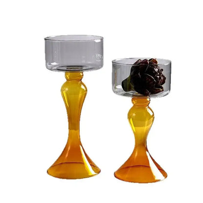 Two amber glass candle holders with flared bases and translucent gray bowls by decorbites geometric glass vase design