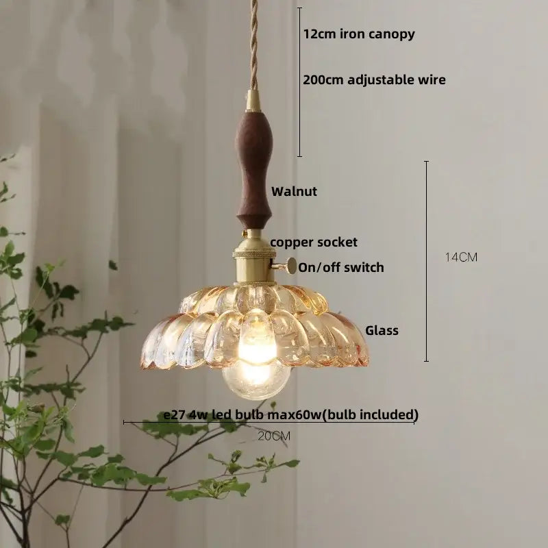 Amber flower glass pendant light with warm tones, walnut wood handle, brass accents, and adjustable wire for dining room