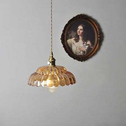 Amber flower glass pendant light with warm amber glass shade and brass finish ideal for dining room pendant lights