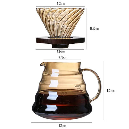 Amber-tinted glass percolator coffee pot with fluted reusable filter and dark wooden base atop matching glass carafe