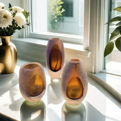 Three amber frosted glass vases with speckled texture and oval cutouts for living room decorbites frosted glass use
