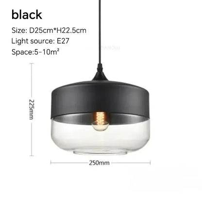 Black and clear glass pendant light fixture with sleek modern design for dining room featuring amber glass and natural wood
