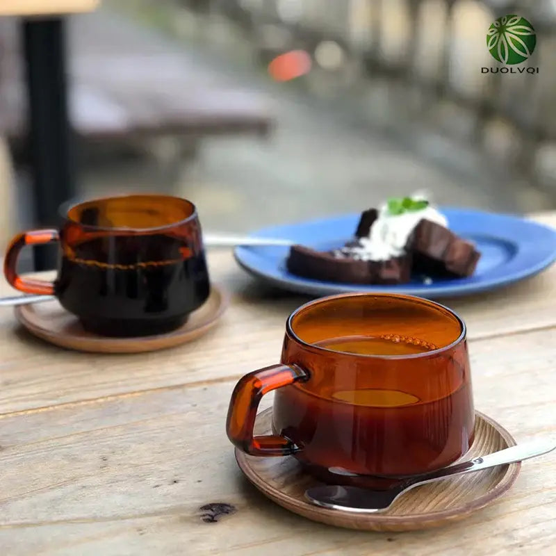 Amber-colored glass coffee mug with smooth translucent finish and matching handle from decorbites glass coffee collection