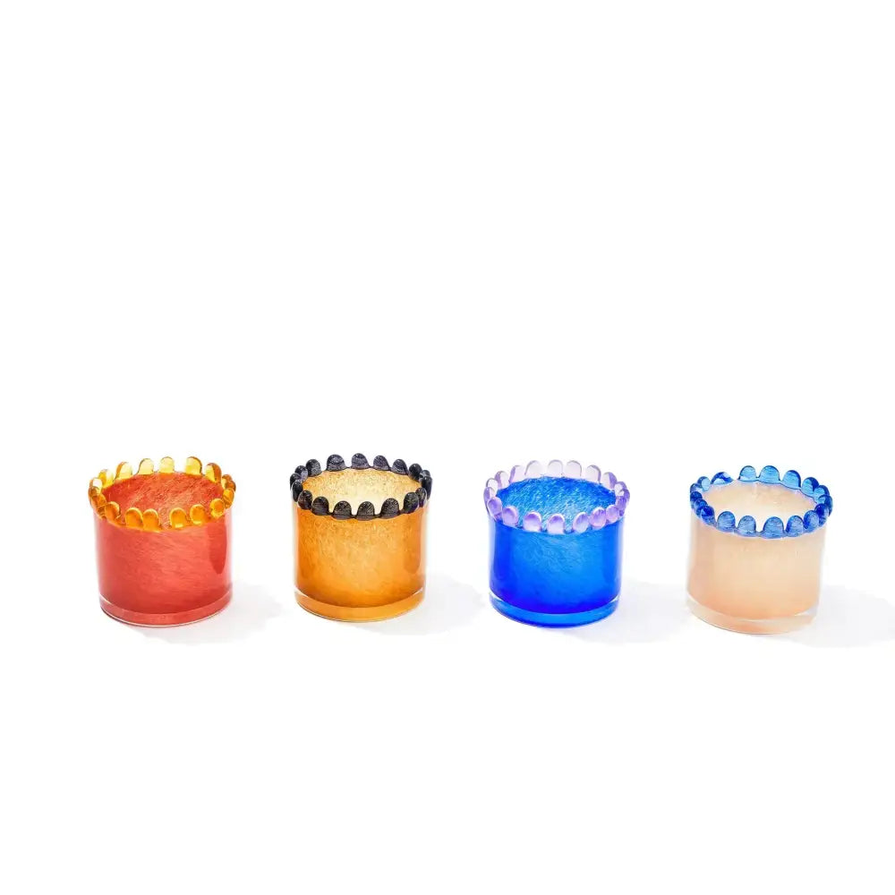 Set of four colorful glass cylinder vase candle holders with scalloped textured rims in orange amber blue and peach hues