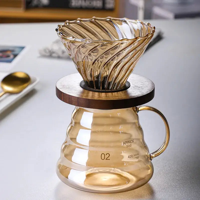 Translucent amber glass coffee filter pot with fluted ribbed cone and matching textured base for pour-over brewing