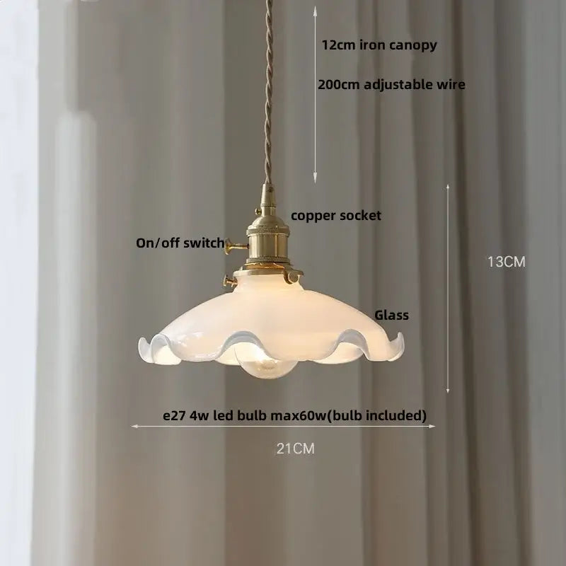Amber glass pendant light with frosted shade and decorbites brass knob switch for elegant dining room lighting