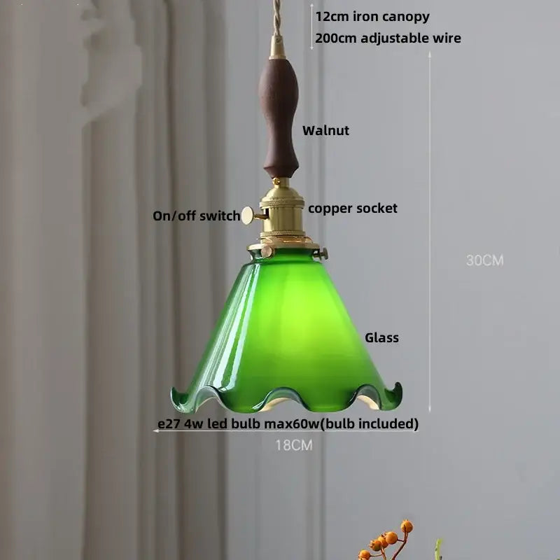 Green glass pendant light with walnut iron canopy and decorbites brass knob switch for dining room lighting