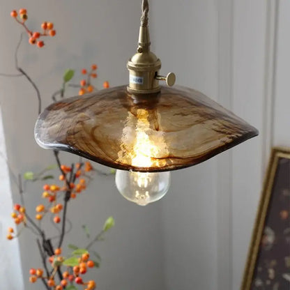 Amber glass pendant light with brass knob switch and exposed bulb ideal for dining room decorbites brass knob fixture