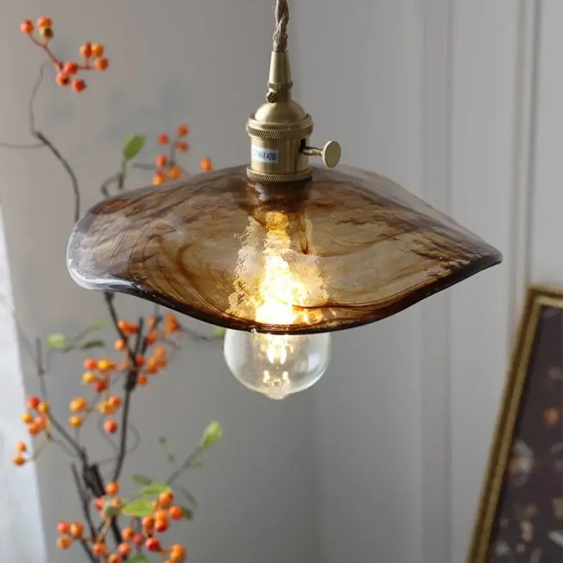 Amber glass pendant light with brass knob switch and exposed bulb ideal for dining room decorbites brass knob fixture
