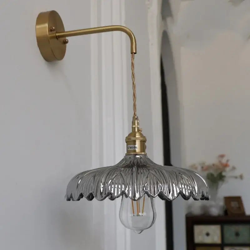 Amber vintage led wall light with a brass pull chain and clear petal-shaped glass shade for stylish wall light decorbites amber vintage