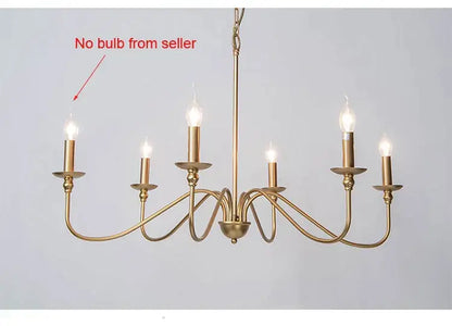 Gold-finished six-light american iron chandelier with black candle style bulbs and ornate curved arms for living room decorbites american iron