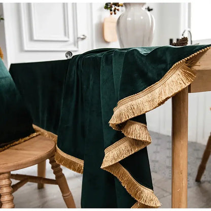 Deep emerald green velvet table runner with layered gold fringe detailing for decorbites gold velvet wedding table cloth decor