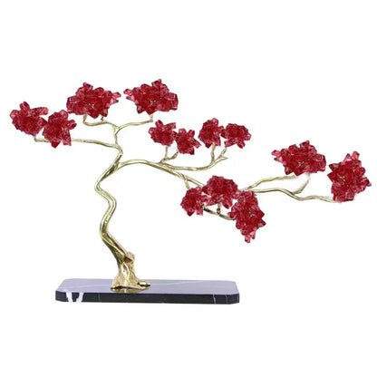 Amethyst and brass decorative sculpture featuring a bonsai tree with golden branches and red crystal blossoms on black marble base