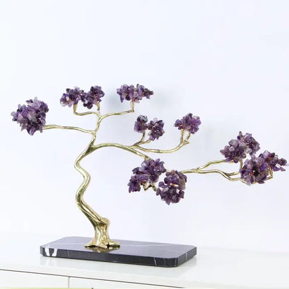 Amethyst and gold metal decorative figurine with brass branches and purple crystals on a black marble base for decor