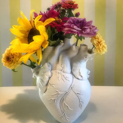 White ceramic heart shape vase with detailed vein carvings for decorbites heart shape living room decor