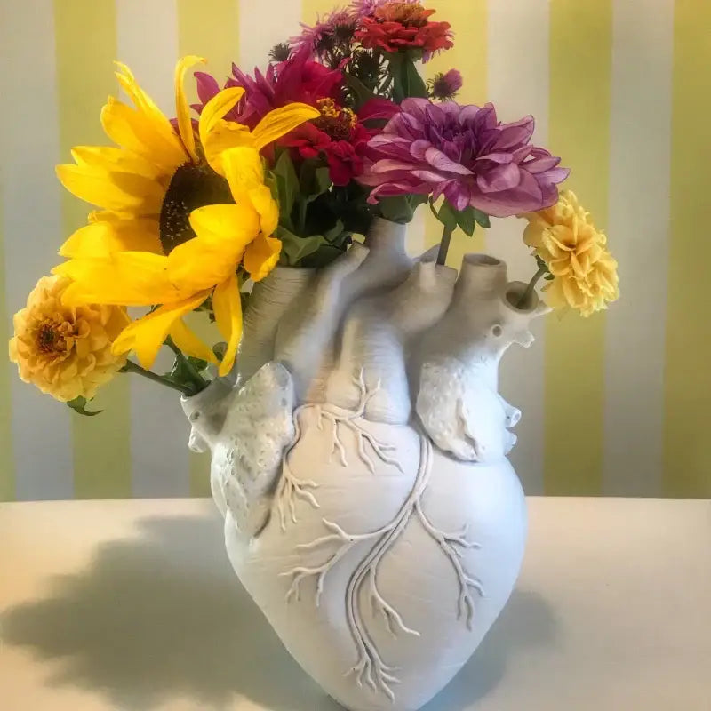 White ceramic heart shape vase with detailed vein carvings for decorbites heart shape living room decor