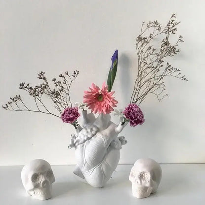 White DecorBites anatomy heart vase with realistic texture holding pink and purple flowers as a unique heart vase gift