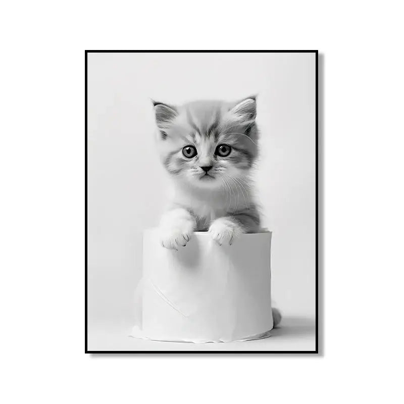 Black-and-white framed cute animal canvas print featuring a fluffy kitten with striking eyes for bathroom wall art