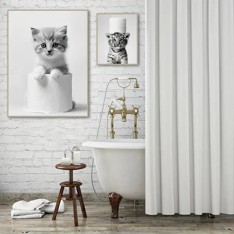 White porcelain clawfoot bathtub with ornate brass fixtures featured in decorbites bathroom wall art cute animal canvas posters