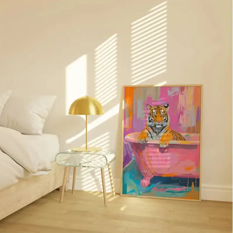 Vibrant animal print canvas wall art featuring a tiger in a pink bathtub with a black cat theme framed in light wood