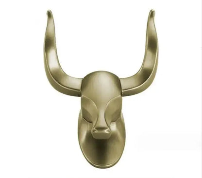 Gold-toned decorbites antique aluminum robe hook featuring a metallic bull head with polished curved horns for bathroom use