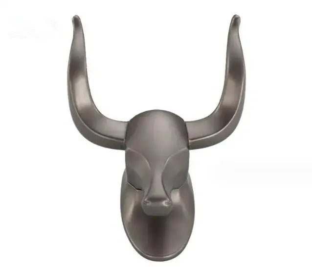A sleek matte-finished antique aluminum robe hook shaped as a bull head with stylized horns for bathroom decorbites decor
