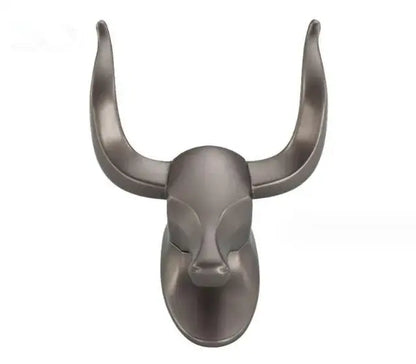 A sleek matte-finished antique aluminum robe hook shaped as a bull head with stylized horns for bathroom decorbites decor