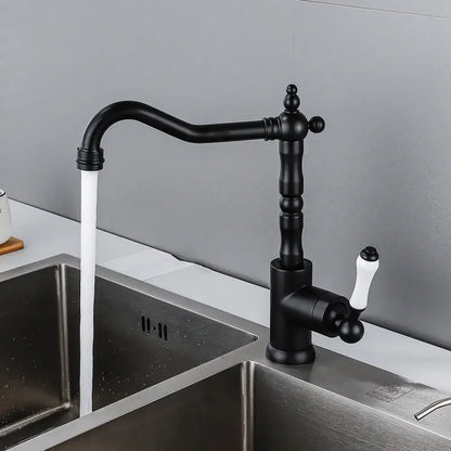 Antique black and white ceramic kitchen faucet with black matte finish and ornate decorbites black antique detailing single lever tap