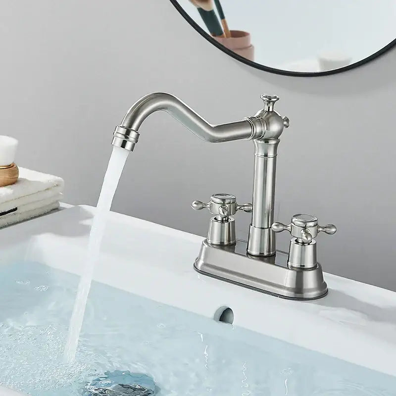 Stainless steel two-handle basin faucet with curved spout and cross handles for decorbites black brass waterfall design