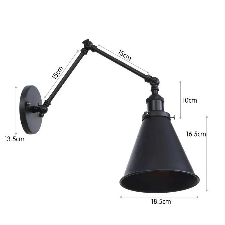 Antique adjustable wall lamp with black industrial-style conical shade and copper accents for bedroom lighting