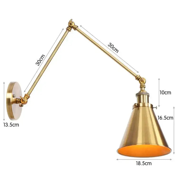 Antique adjustable wall lamp sconce in brass finish with conical shade and orange interior for bedroom lighting