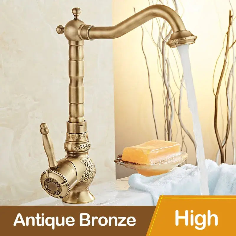 Antique black bronze basin mixer tap with ornate floral carving and curved swivel spout for bathroom basin use