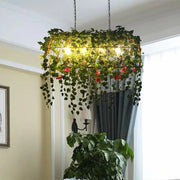 DecorBites™ antique black metal island chandelier with birdcage heads and green vines for restaurants and plant ceilings