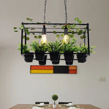 DecorBites antique black metal island pendant with two heads, LED lighting, and integrated planters with green foliage