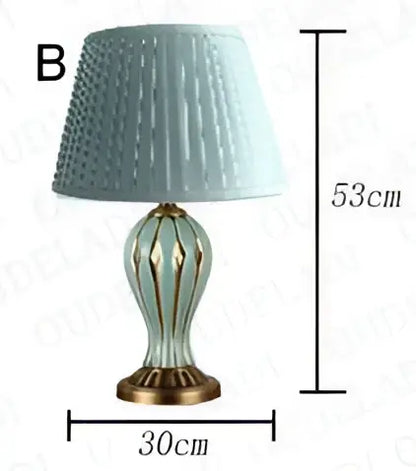 Antique blue ceramic desk lamp with light blue textured lampshade and glass brass base for bedroom use