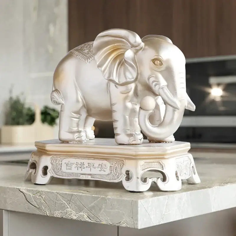 Silver elephant couple resin statue with gold accents on ornate white base engraved with chinese characters decorbites elephant couple decor