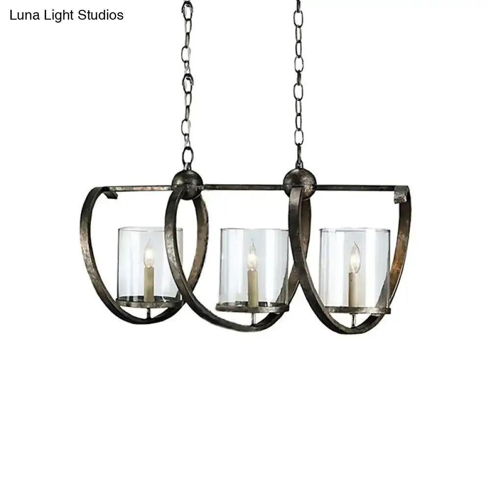 Antique brass and aged silver DecorBites three-bulb dining room chandelier with clear glass candle holders and white taper candles