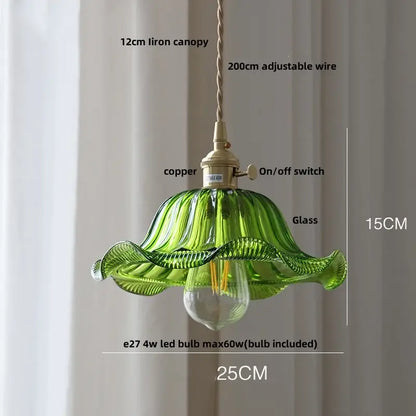 Antique brass and amber glass led pendant light with green glass led hanging leaf design and brass accents